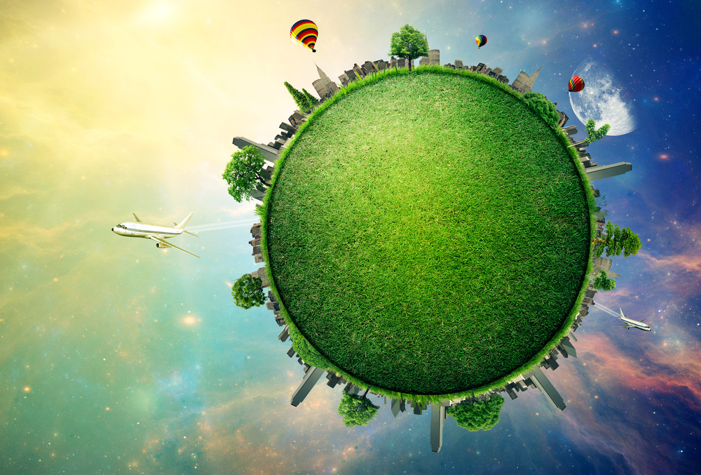 Grüner Planet vor einem blaurotem Himmel